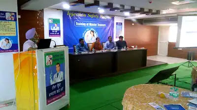Stage panel and lectern at Injection Safety master trainers training (Punjab, 2019)