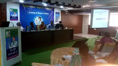 Stage with panel and presentation screen, Injection Safety training of master trainers (Punjab, 2019)