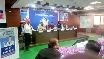 Speaker at lectern during Injection Safety training of master trainers (Punjab, 2019)