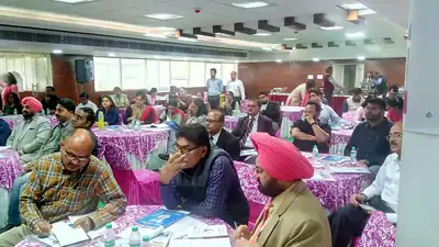 Participants seated at round tables during Injection Safety master trainers training (Punjab, 2019)