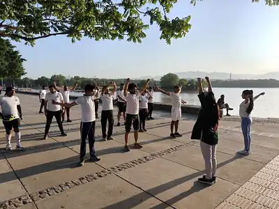 Morning stretching session beside lake, Millet Cyclothon, Chandigarh
