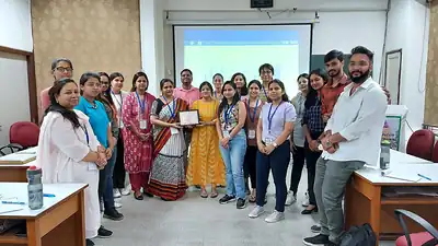 Group photo of participants in classroom after nutrition workshop