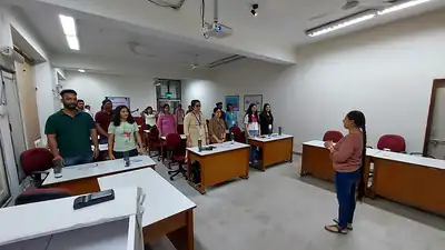 Facilitator addressing participants in classroom at public health nutrition workshop