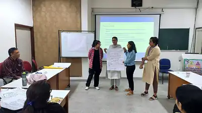 Participants presenting group work in classroom
