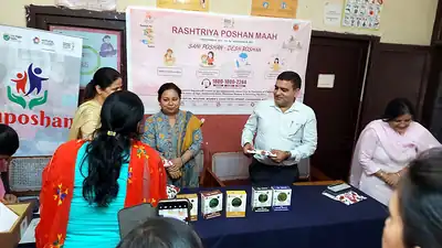 Rashtriya Poshan Maah table display with millet products and officials