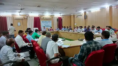 Participants around meeting table at nutrition meeting