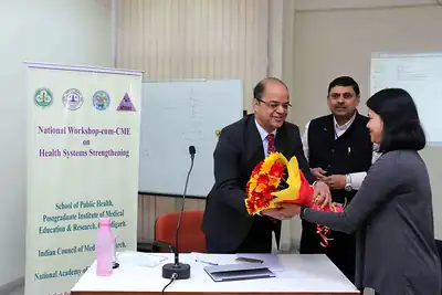 Guest being presented with a bouquet during workshop at 2nd NWHSS 2016, PGIMER Chandigarh