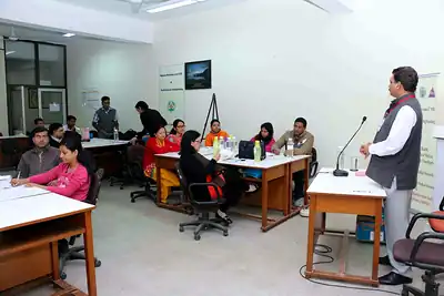 Faculty speaking to participants seated at tables in training room at 2nd NWHSS 2016, PGIMER Chandigarh