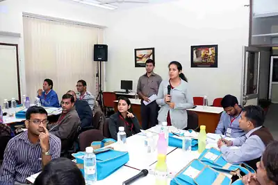 Participants seated around tables during group discussion at 2nd NWHSS 2016, PGIMER Chandigarh
