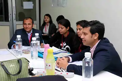 Participants working together at a group table at 2nd NWHSS 2016, PGIMER Chandigarh
