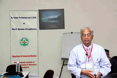 Senior participant seated in front of workshop banner at 2nd NWHSS 2016, PGIMER Chandigarh