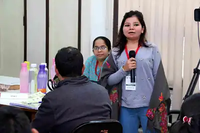 Participant speaking into microphone during group session at 2nd NWHSS 2016, PGIMER Chandigarh