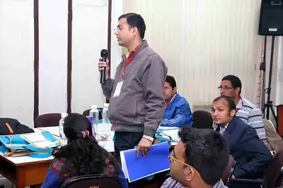 Standing participant with microphone addressing workshop group at 2nd NWHSS 2016, PGIMER Chandigarh