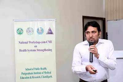 Speaker with microphone in front of workshop banner at 2nd NWHSS 2016, PGIMER Chandigarh