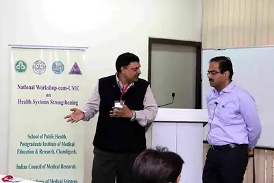 Two speakers beside podium in front of workshop banner at 2nd NWHSS 2016, PGIMER Chandigarh