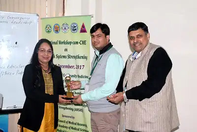 Presentation of a certificate or memento to a participant or speaker at NWHSS 2017, PGIMER Chandigarh