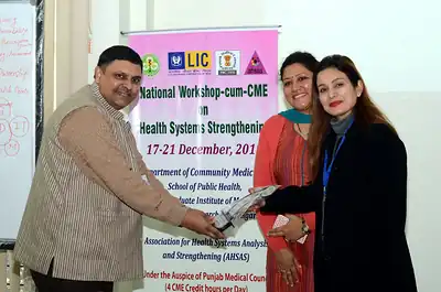 Memento being presented to a guest, 4th NWHSS, PGIMER Dec 2018