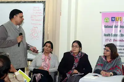 Facilitator with a microphone and group work participants, 4th NWHSS, PGIMER Dec 2018