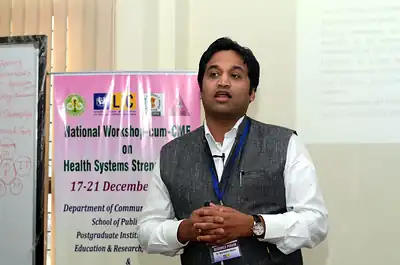 Speaker presenting in front of the workshop banner, 4th NWHSS, PGIMER Dec 2018
