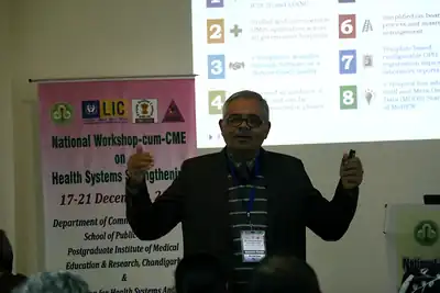 Speaker presenting in front of the screen, 4th NWHSS, PGIMER Dec 2018