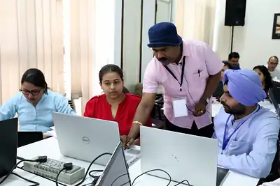 Trainer guiding participants on laptops, 5th NWHSS GIS for public health, PGIMER 2019