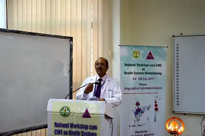 Speaker at the podium beside the GIS workshop banner, 5th NWHSS GIS for public health, PGIMER 2019