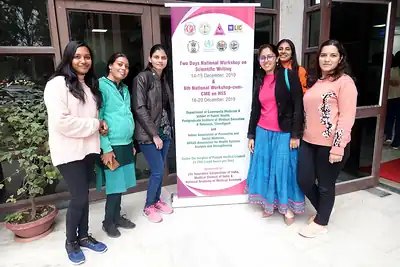 Women participants posing beside the workshop banner, 6th NWHSS with Scientific Writing workshop, PGIMER Dec 2019