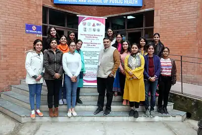 Participants posing on the steps of the School of Public Health, 6th NWHSS with Scientific Writing workshop, PGIMER Dec 2019