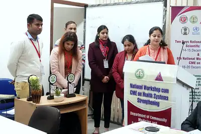 Organisers standing beside the podium and mementos, 6th NWHSS with Scientific Writing workshop, PGIMER Dec 2019