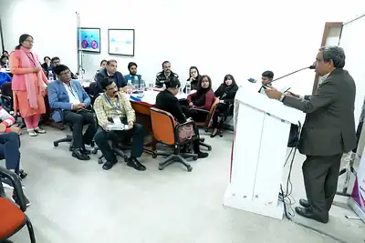 Speaker at the podium addressing seated participants, 6th NWHSS with Scientific Writing workshop, PGIMER Dec 2019