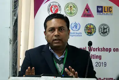 Speaker in front of the workshop banner, 6th NWHSS with Scientific Writing workshop, PGIMER Dec 2019