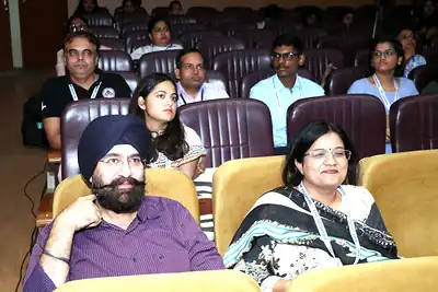 Audience members seated at PHASECON 2023