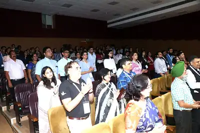 Audience standing during inauguration at PHASECON 2023