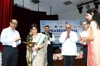Guests lighting ceremonial lamp at PHASECON 2023 inauguration