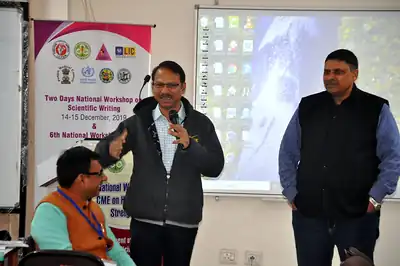 Two speakers beside workshop banner, scientific writing workshop